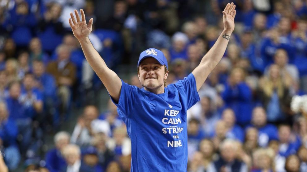 Josh Hutcherson waves to the crowd during the Louisville Cardinals  game against the Kentucky Wildcats at Rupp Arena, Dec. 28, 2013, in Lexington, Ky. 
