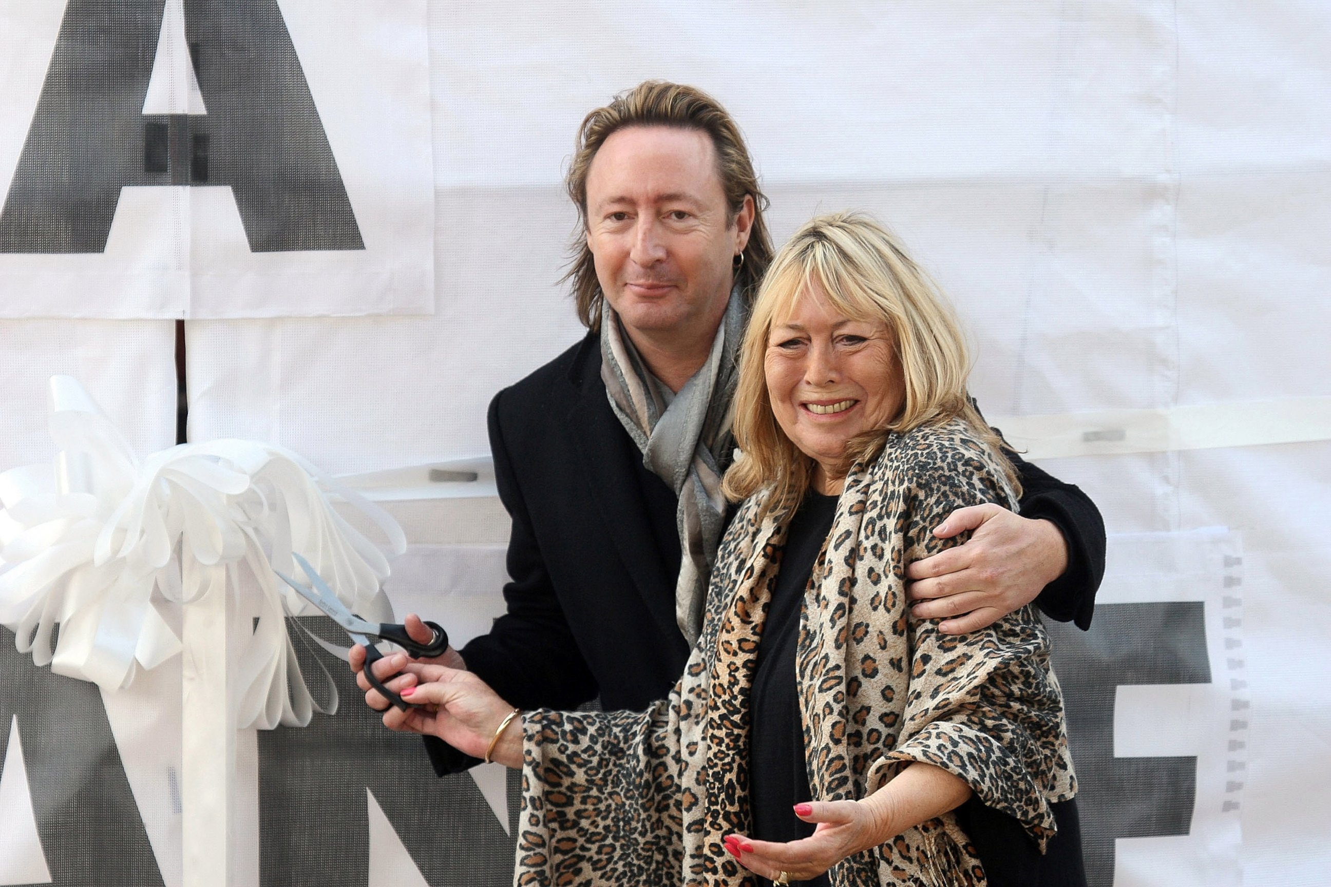 PHOTO: Julian Lennon and Cynthia Lennon, the son and first wife of John Lennon, attend the unveiling of the John Lennon monument 'Peace & Harmony' at Chavasse Park, Oct. 9, 2010, in Liverpool, England.