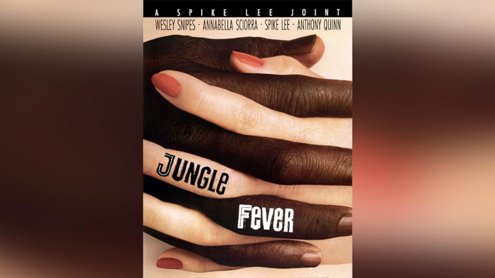 A movie poster advertises the drama 'Jungle Fever,' directed by Spike Lee and starring Wesley Snipes, Annabella Sciorra, Anthony Quinn, Ruby Dee, Ossie Davis, Samuel L. Jackson, Queen Latifah, and Halle Berry, 1991.
