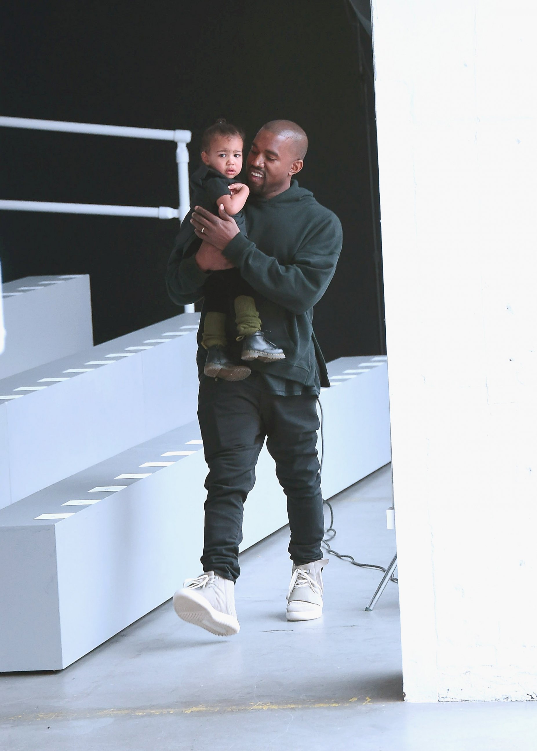 PHOTO: Kanye West and North West attend the adidas show during Mercedes-Benz Fashion Week Fall 2015 at Skylight Clarkson Sq., Feb. 12, 2015, in New York. 
