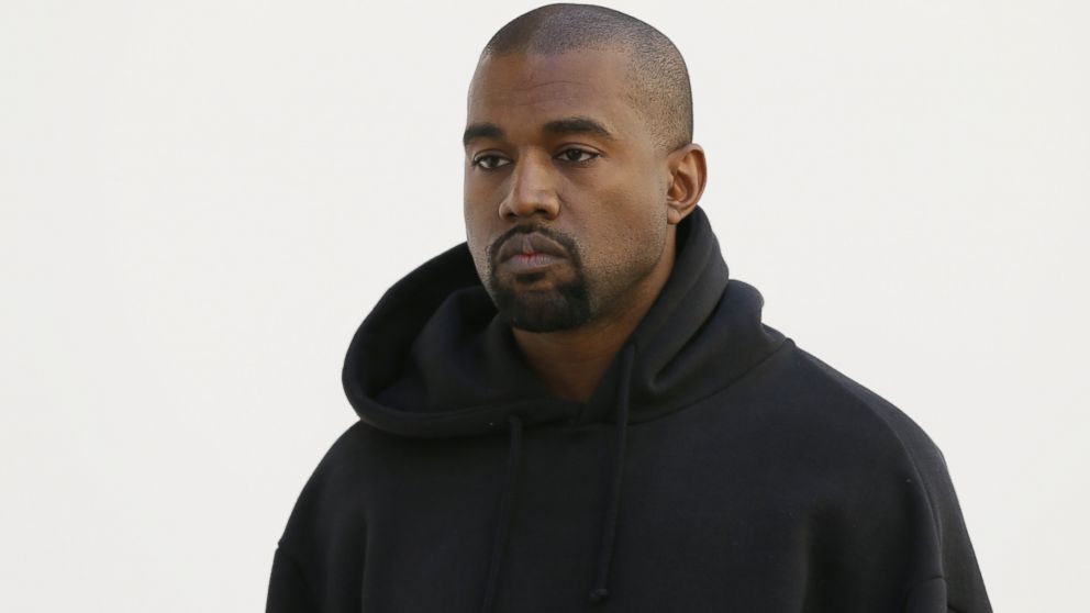American rapper Kanye West poses before Christian Dior 2015-2016 fall/winter ready-to-wear collection fashion show, March 6, 2015, in Paris.