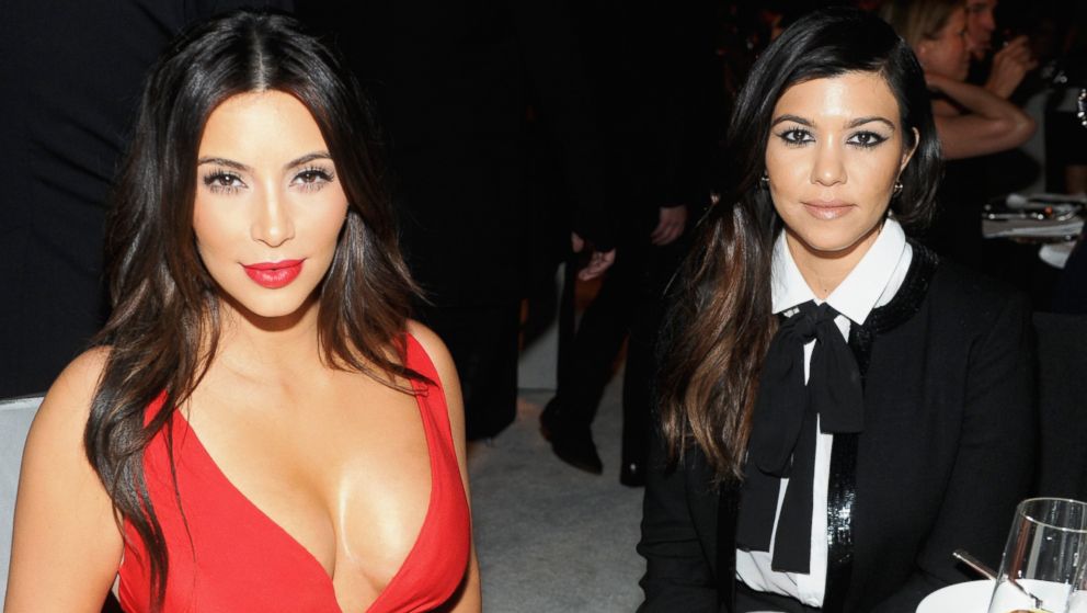Kim Kardashian, left, and Kourtney Kardashian, right, attend the 22nd Annual Elton John AIDS Foundation Academy Awards Viewing Party on March 2, 2014 in West Hollywood, Calif.