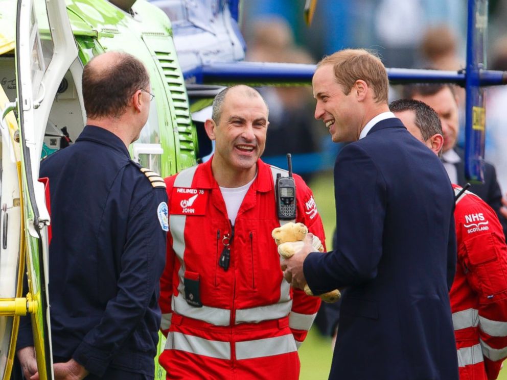 PHOTO: Prince William, Duke of Cambridge meets Air Ambulance pilots & medics as he visits Strathearn Community Campus on a day of engagements in Strathearn on May 29, 2014 in Crieff, Scotland.