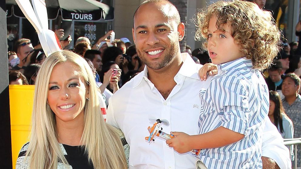 Hank Baskett and Kendra Wilkinson Baskett with son Hank Baskett IV attend the Disney's "Planes" Los Angeles premiere held  at the El Capitan Theatre, Aug. 5, 2013, in Hollywood, Calif. (Photo by JB Lacroix/WireImage)