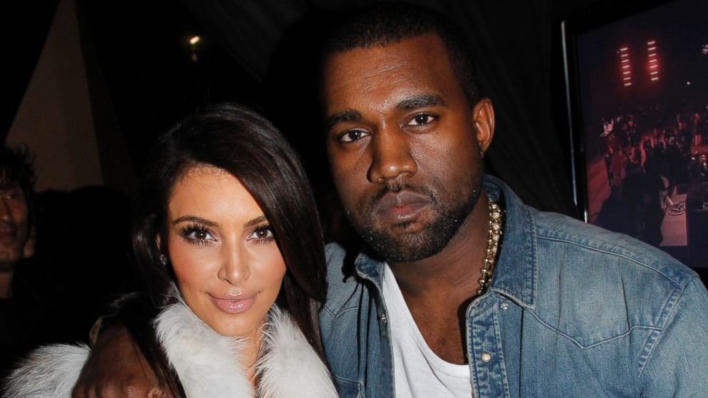 Kim Kardashian and Kanye West attend the Kanye West Ready-To-Wear Fall/Winter 2012 show as part of Paris Fashion Week at Halle Freyssinet in this March 6, 2012, file photo.