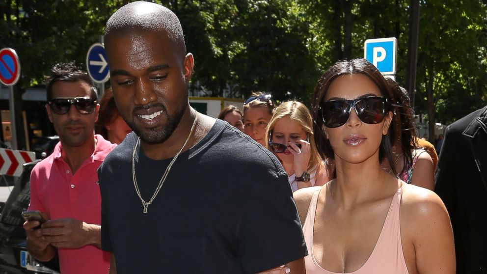 Kim Kardashian and Kanye West are seen strolling on the 'Avenue Montaigne' on May 19, 2014 in Paris, France. 