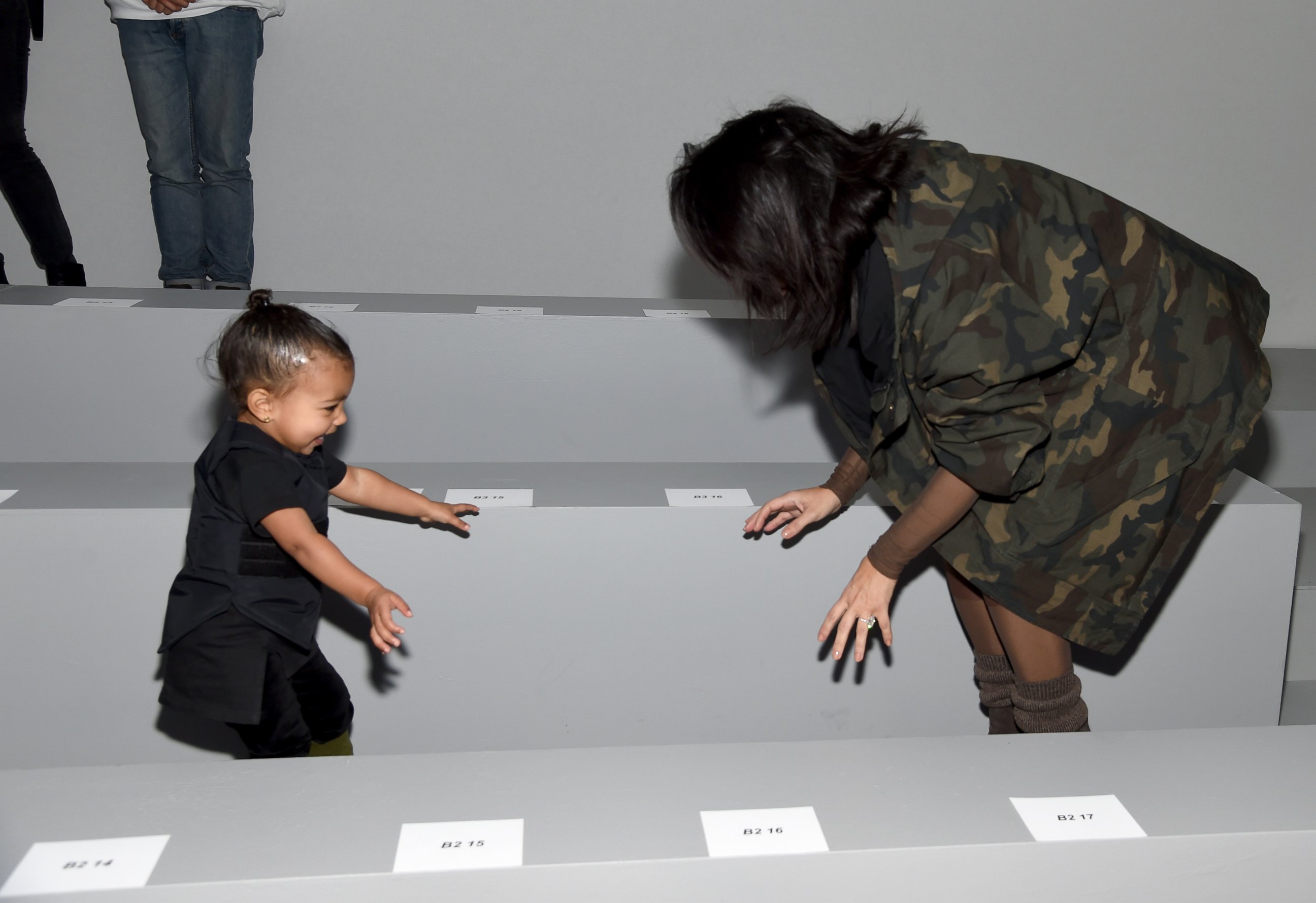 PHOTO: Kim Kardashian and daughter North attend the adidas Originals x Kanye West YEEZY SEASON 1 fashion show during New York Fashion Week Fall 2015 at Skylight Clarkson Sq., Feb. 12, 2015 in New York.