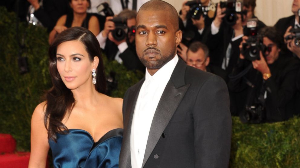 Kim Kardashian, left, and Kanye West, right, attend the "Charles James: Beyond Fashion" Costume Institute Gala at the Metropolitan Museum of Art on May 5, 2014 in New York City.  