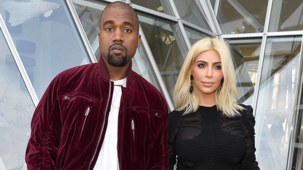 Kanye West and Kim Kardashian attend the Louis Vuitton show as part of the Paris Fashion Week Womenswear Fall/Winter 2015/2016, March 11, 2015, in Paris.  