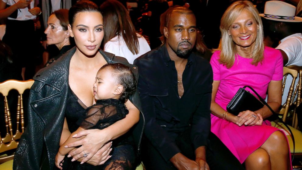 Kim Kardashian, Kanye West, their daughter North West and Delphine Arnault attend the Givenchy show as part of the Paris Fashion Week Womenswear Spring/Summer 2015, Sept. 28, 2014 in Paris.