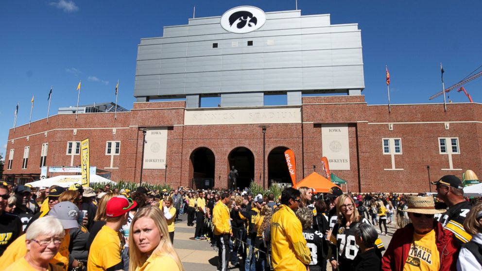PHOTO: Fans gather outside Kinnick Stadium before the match-up between the Iowa Hawkeyes and the Iowa State Cyclones, September 13, 2014, in Iowa City, Iowa.