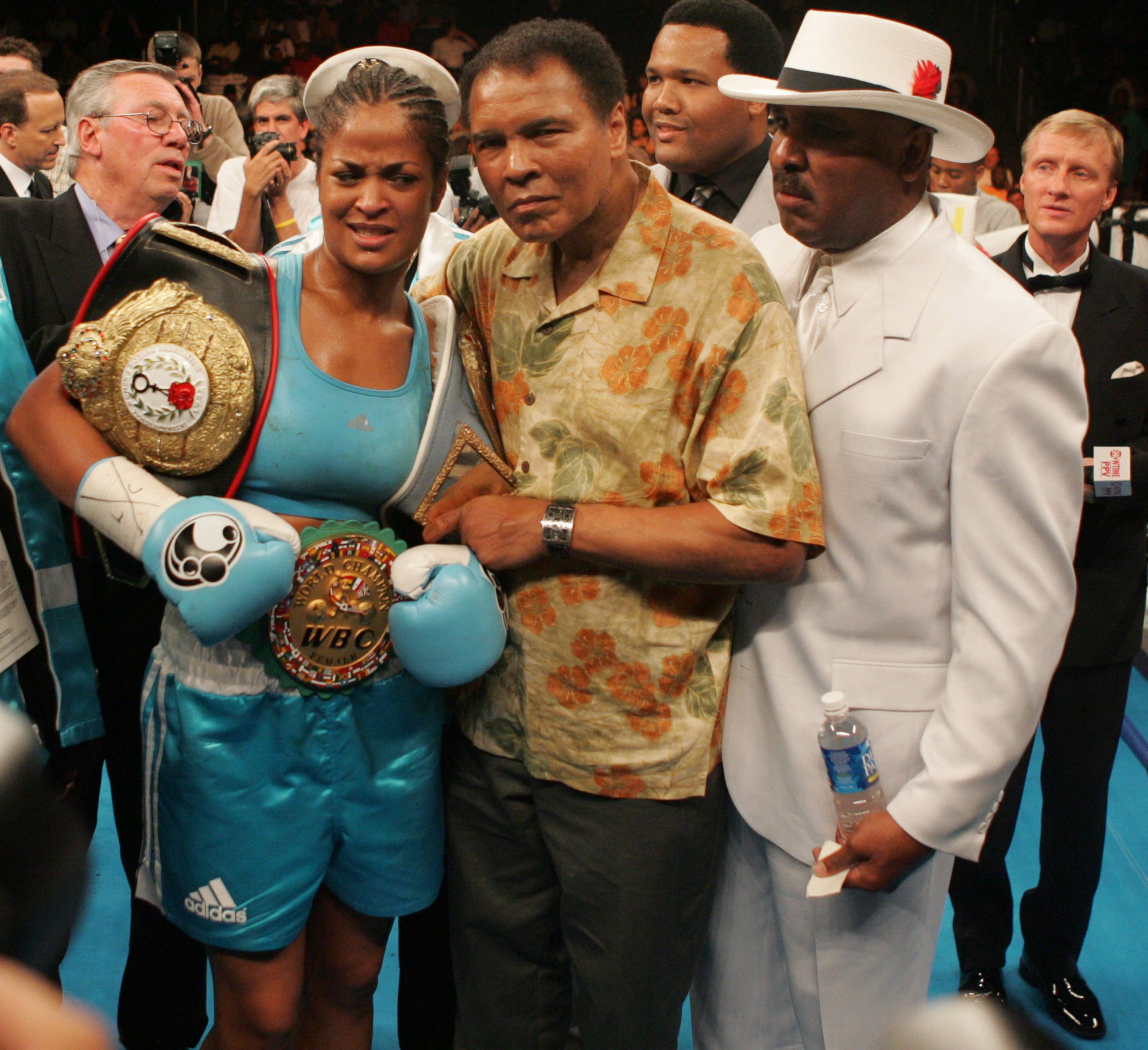 PHOTO:Laila Ali poses with her father, Muhammad Ali, after her 10 round WBC/WIBA Super Middleweight title bout with Erin Toughill, June 11, 2005, in Washington. 