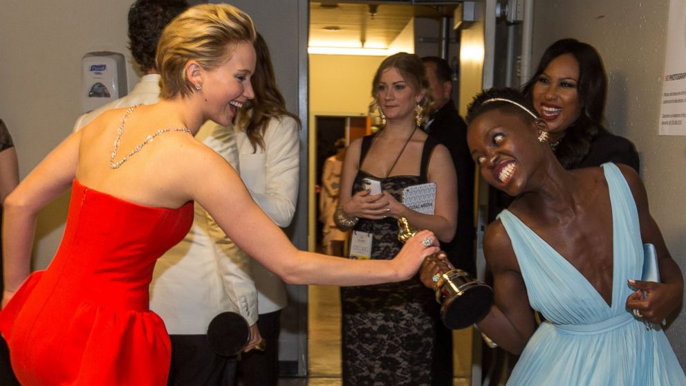 PHOTO: Jennifer Lawrence, left, is pictured with Lupita Nyong'o, right, backstage during the Oscars on Mar. 2, 2014 in Hollywood, Calif.  