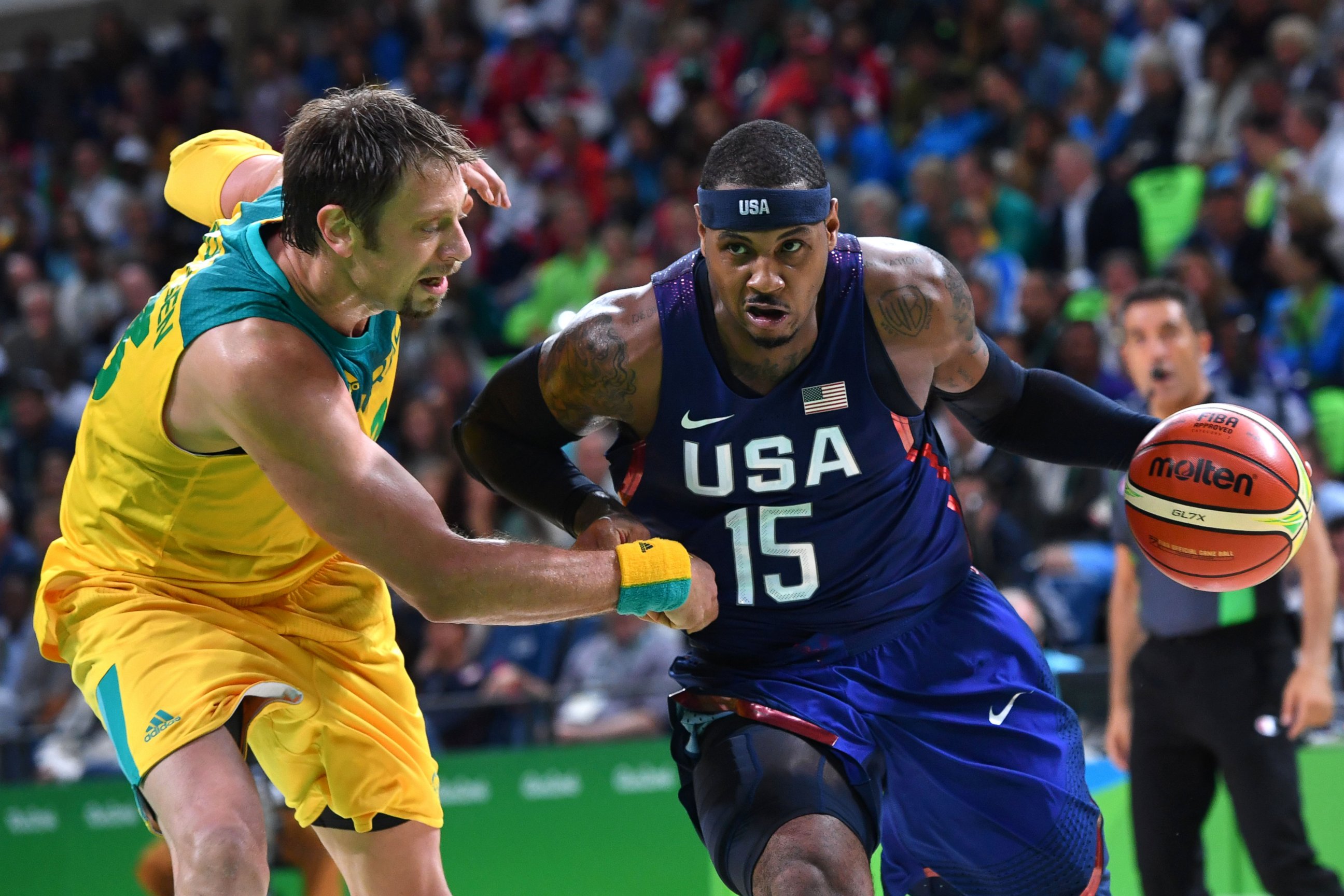 PHOTO: Australia's centre David Andersen vies with USA's forward Carmelo Anthony during a Men's basketball match between Australia and USA at the Carioca Arena 1 on Aug. 10, 2016 during the Rio 2016 Olympic Games.