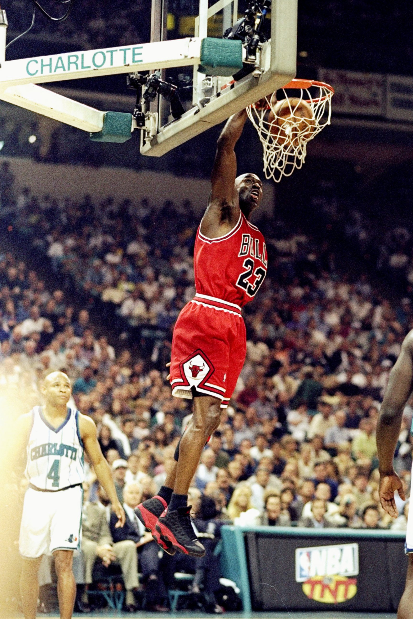 PHOTO: Michael Jordan #23 of the Chicago Bulls jumps slam dunk during the Eastern Conference Semifinals against the Charlotte Hornets at Charlotte Coliseum in Charlotte, North Carolina, May 8, 1998. 