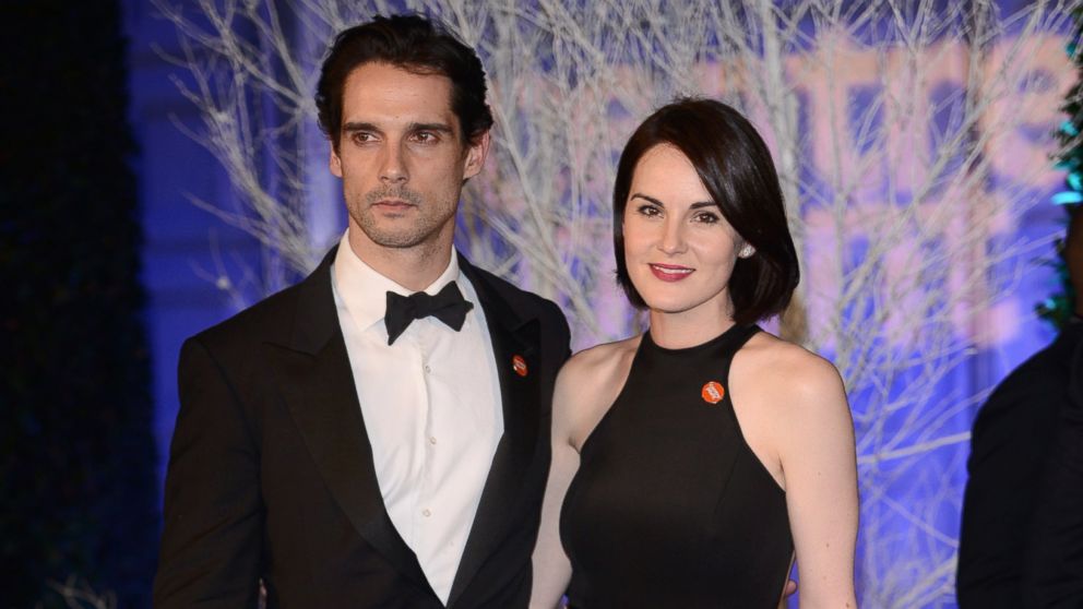 John Dineen and Michelle Dockery attend the Winter Whites Gala at Kensington Palace on Nov. 26, 2013 in London. 