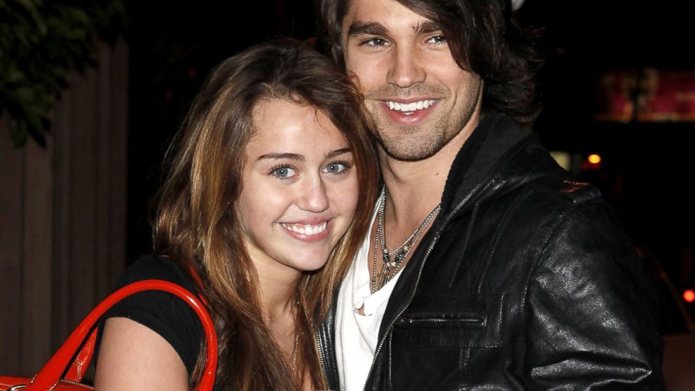 Miley Cyrus and Justin Gaston visit Nubu, March 9, 2009, in West Hollywood, Calif.