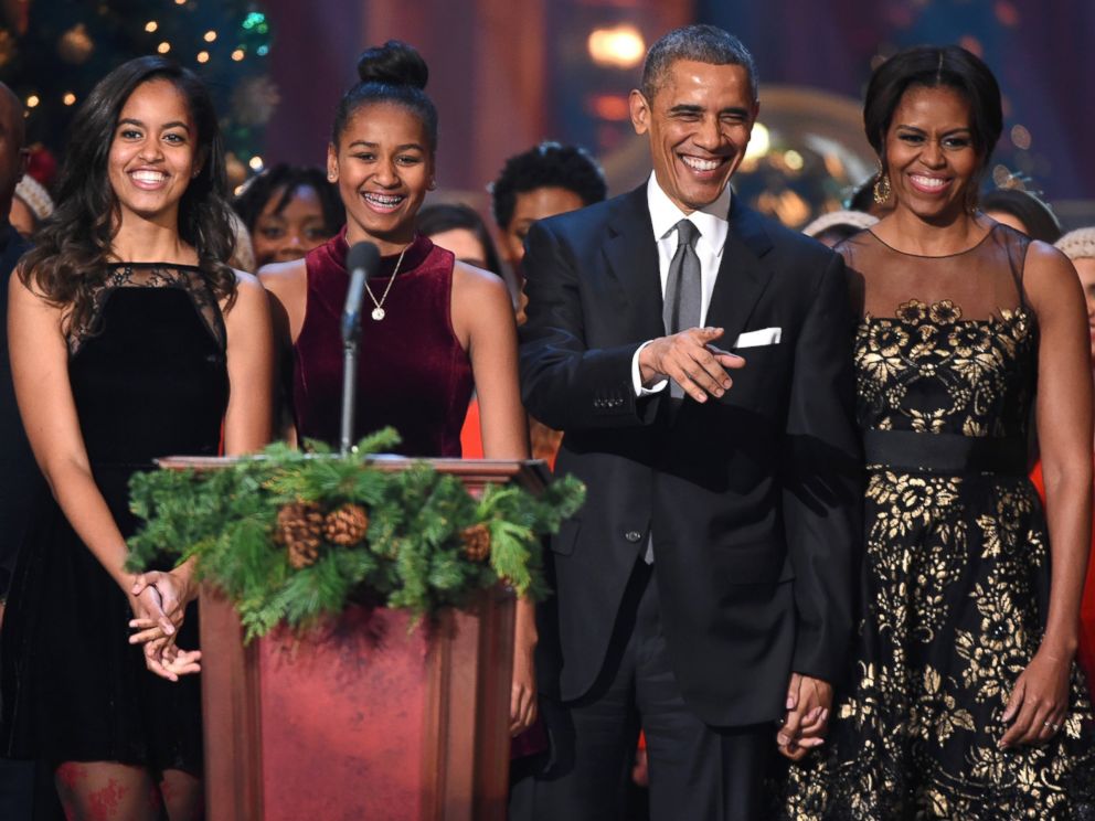 PHOTO: From left, Malia Obama, Sasha Obama, President Barack Obama and first lady Michelle Obama speak onstage at TNT Christmas in Washington 2014 at the National Building Museum, Dec. 14, 2014, in Washington.