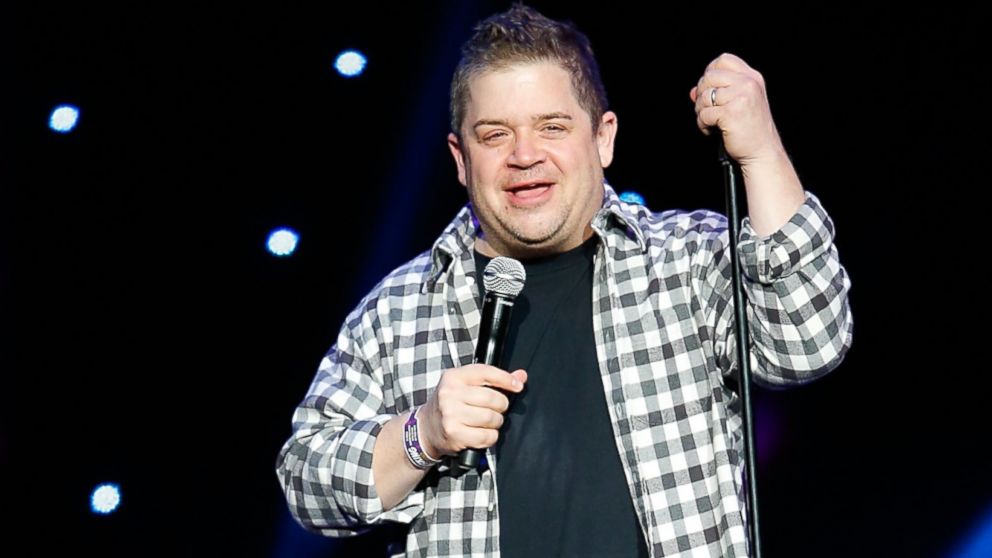 Patton Oswalt performs onstage at the Shrine Auditorium, April 5, 2014 in Los Angeles, Calif.