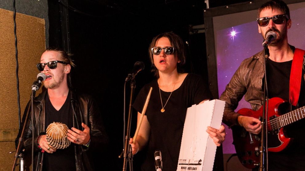 PHOTO: Left to right, Macaulay Culkin, Deenah Vollmer and Matt Colbourn of Pizza Underground perform onstage at The Hi Ho Lounge on March 17, 2014 in New Orleans, Louisiana.  