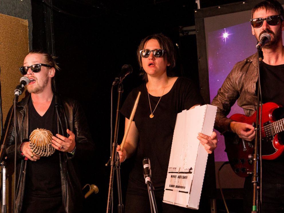 PHOTO: Left to right, Macaulay Culkin, Deenah Vollmer and Matt Colbourn of Pizza Underground perform onstage at The Hi Ho Lounge on March 17, 2014 in New Orleans, Louisiana.
