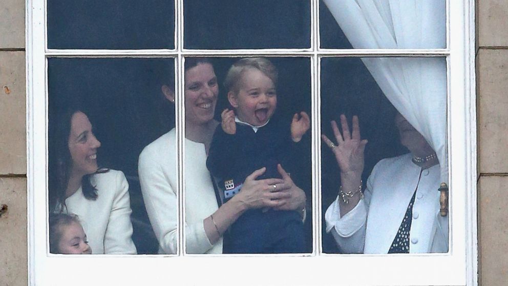 PHOTO: Prince George of Cambridge is held by his nanny Maria Teresa Turrion Borrallo  at the window of Buckingham Palace as he watches the Trooping The Color ceremony in London, June 13, 2015. 