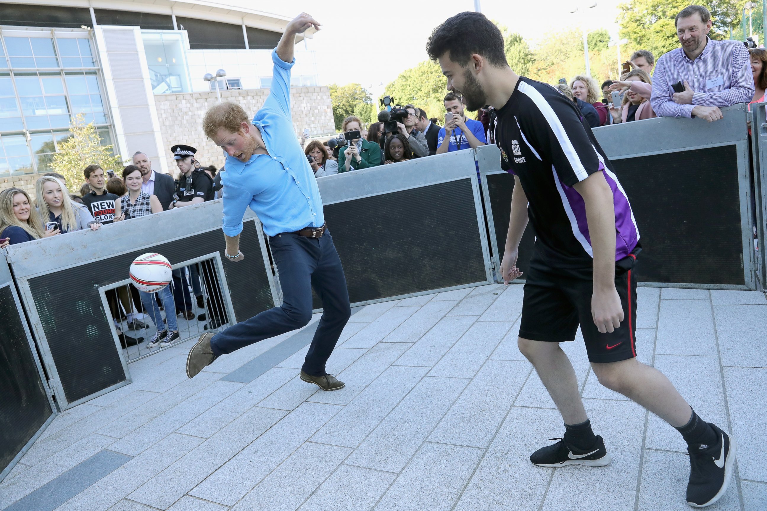 PHOTO: Prince Harry plays panna knockout football with Nordean Elouissi as part of the Streetsport initiative during a visit to Robert Gordon University, Sept. 20, 2016, in Aberdeen, Scotland. 