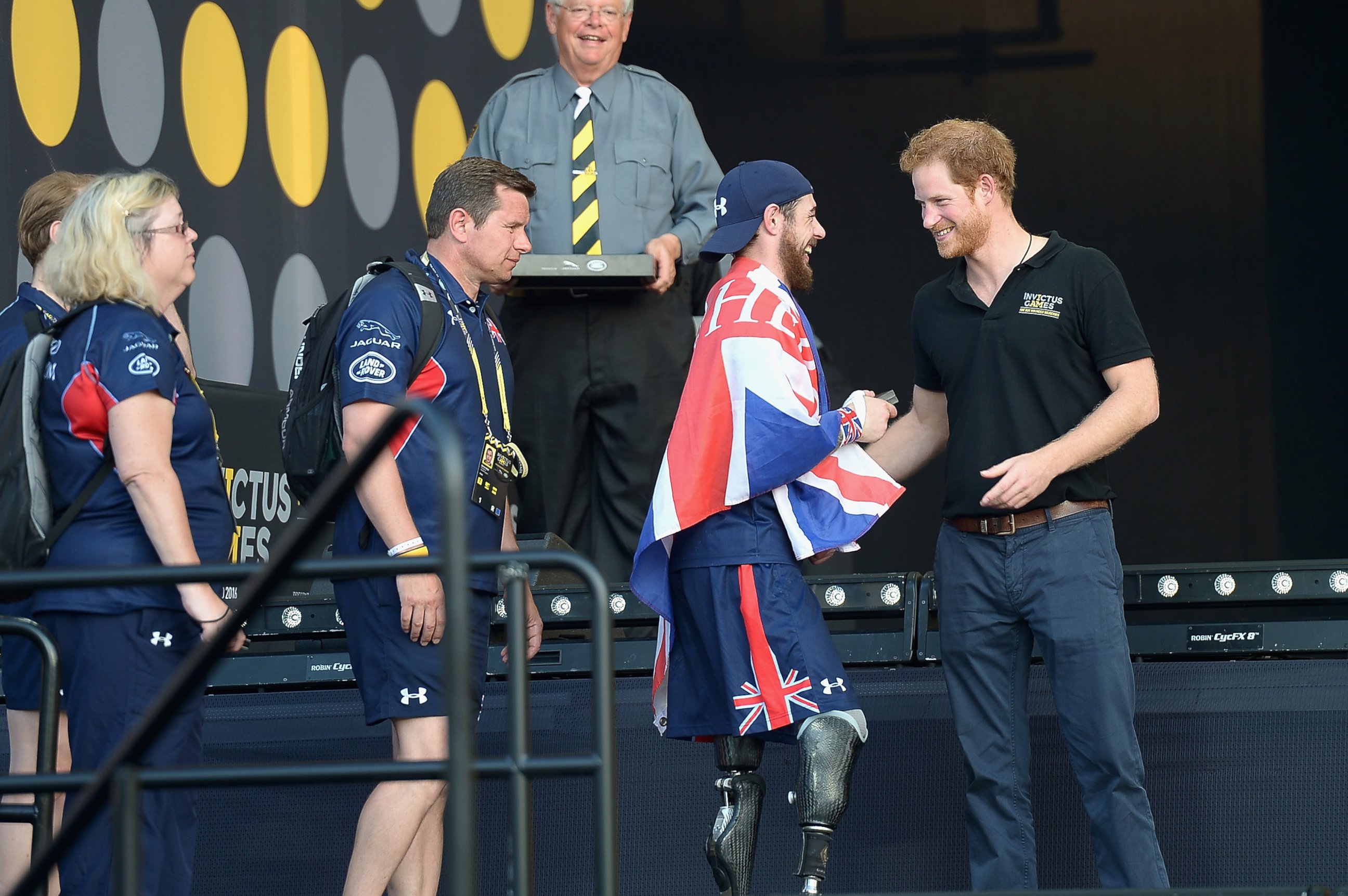 PHOTO: Prince Harry  greets sports competitors onstage at the Invictus Games Orlando 2016 - Closing Ceremony at ESPN Wide World of Sports Complex, May 12, 2016, in Lake Buena Vista, Fla.  