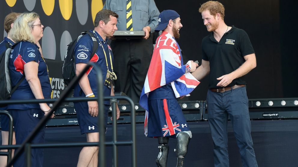 Prince Harry greets sports competitors onstage at the Invictus Games Orlando 2016 - Closing Ceremony at ESPN Wide World of Sports Complex, May 12, 2016, in Lake Buena Vista, Fla.