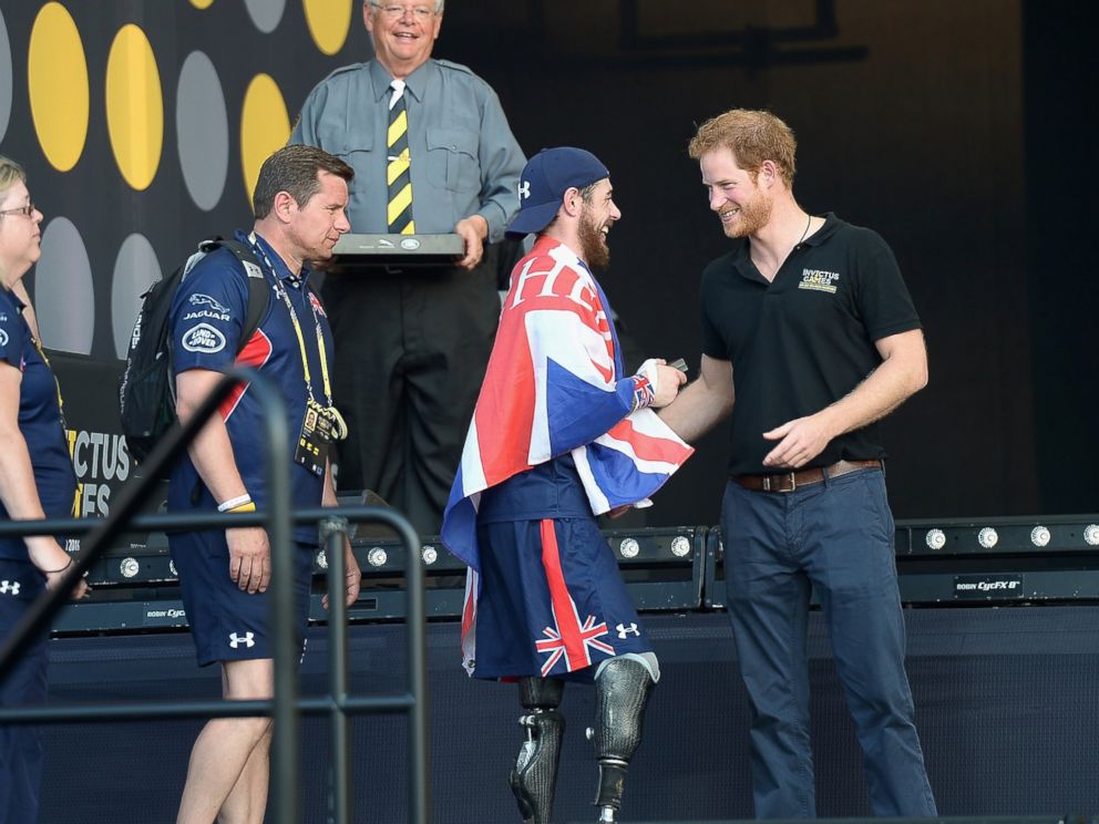 PHOTO: Prince Harry greets sports competitors onstage at the Invictus Games Orlando 2016 - Closing Ceremony at ESPN Wide World of Sports Complex, May 12, 2016, in Lake Buena Vista, Fla.
