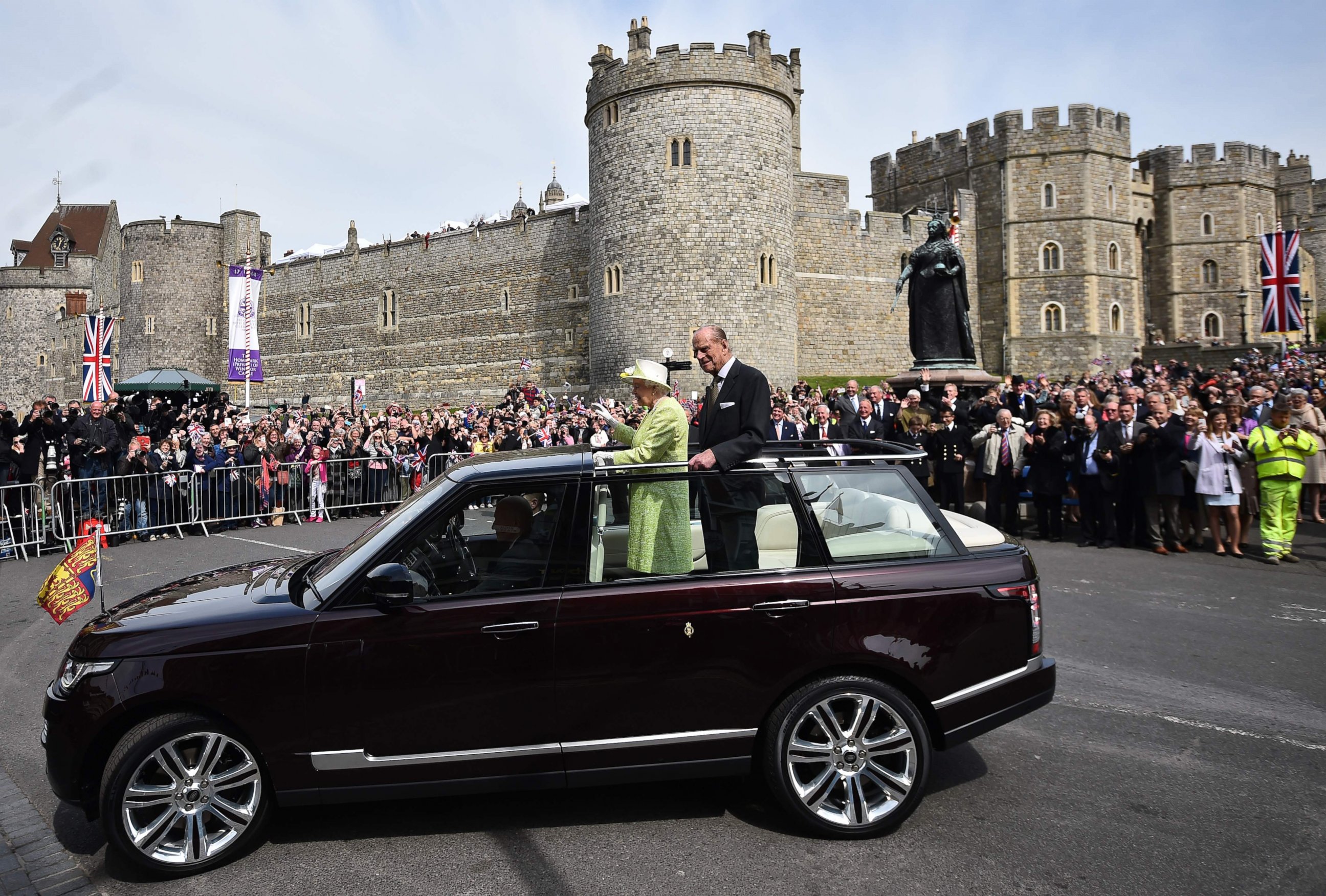 PHOTO: Britain's Queen Elizabeth II, accompanied by Prince Philip, Duke of Edinburgh, waves to  well-wishers during a walkabout on her 90th birthday in Windsor, Britain, April 21, 2016.