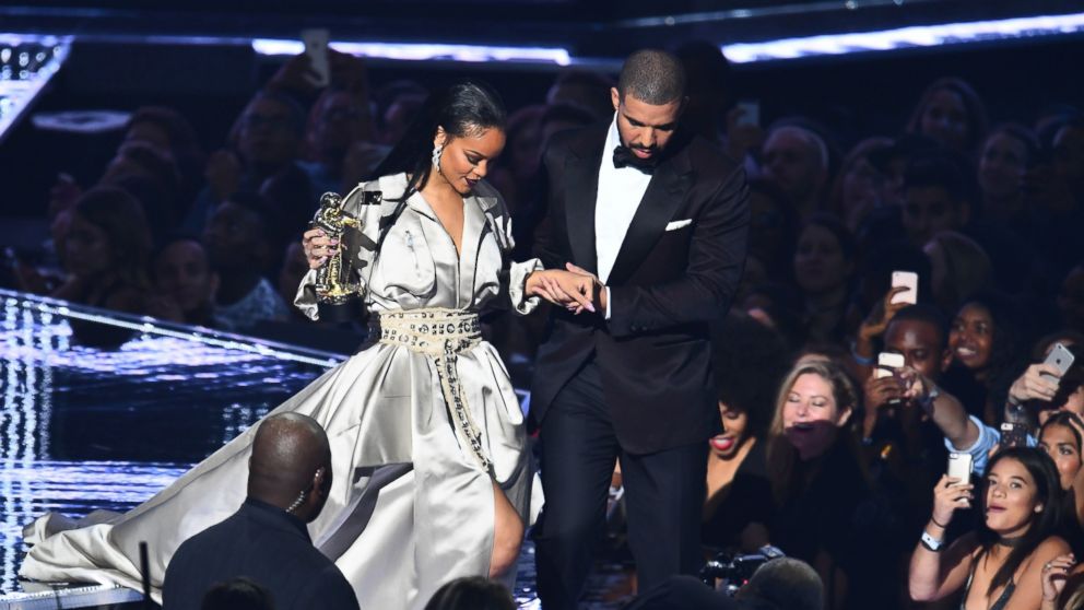 Drake escorts Rihanna after presenting her with The Video Vanguard Award during the 2016 MTV Video Music Awards at the Madison Square Garden in New York, Aug. 28, 2016.