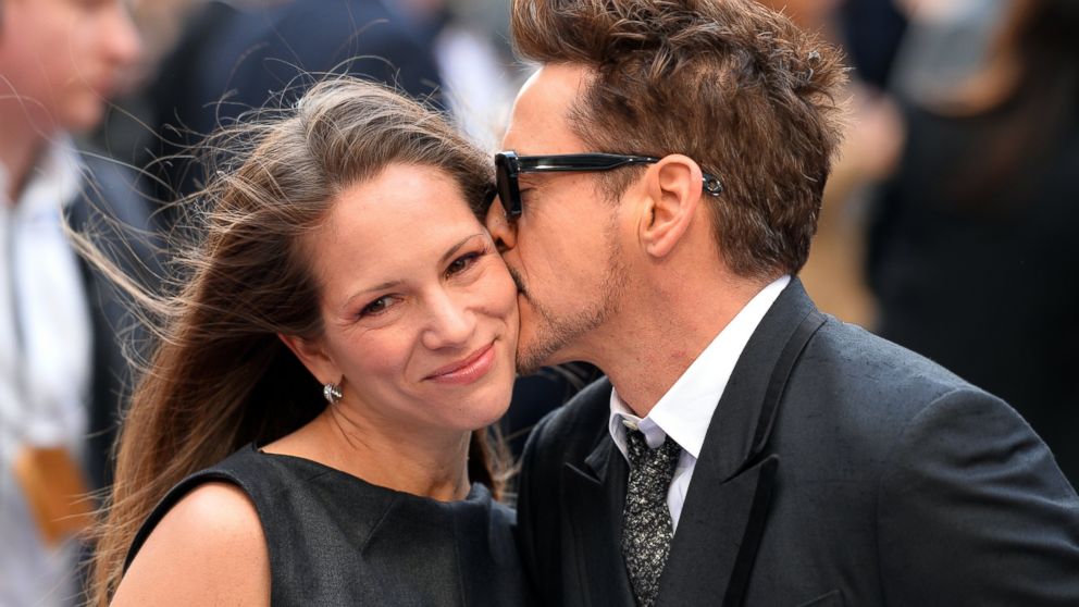 Robert Downey Jr kisses his wife Susan on the red carpet as he arrives for the premiere of "Iron Man 3" in Leicester Square, April 18, 2013, in London. 