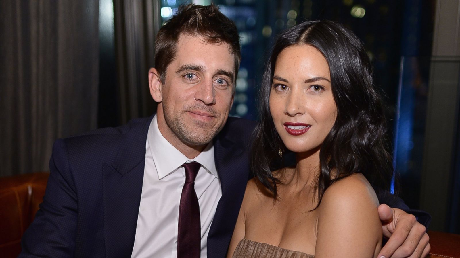 Olivia Munn scores a kiss from NFL player Aaron Rodgers