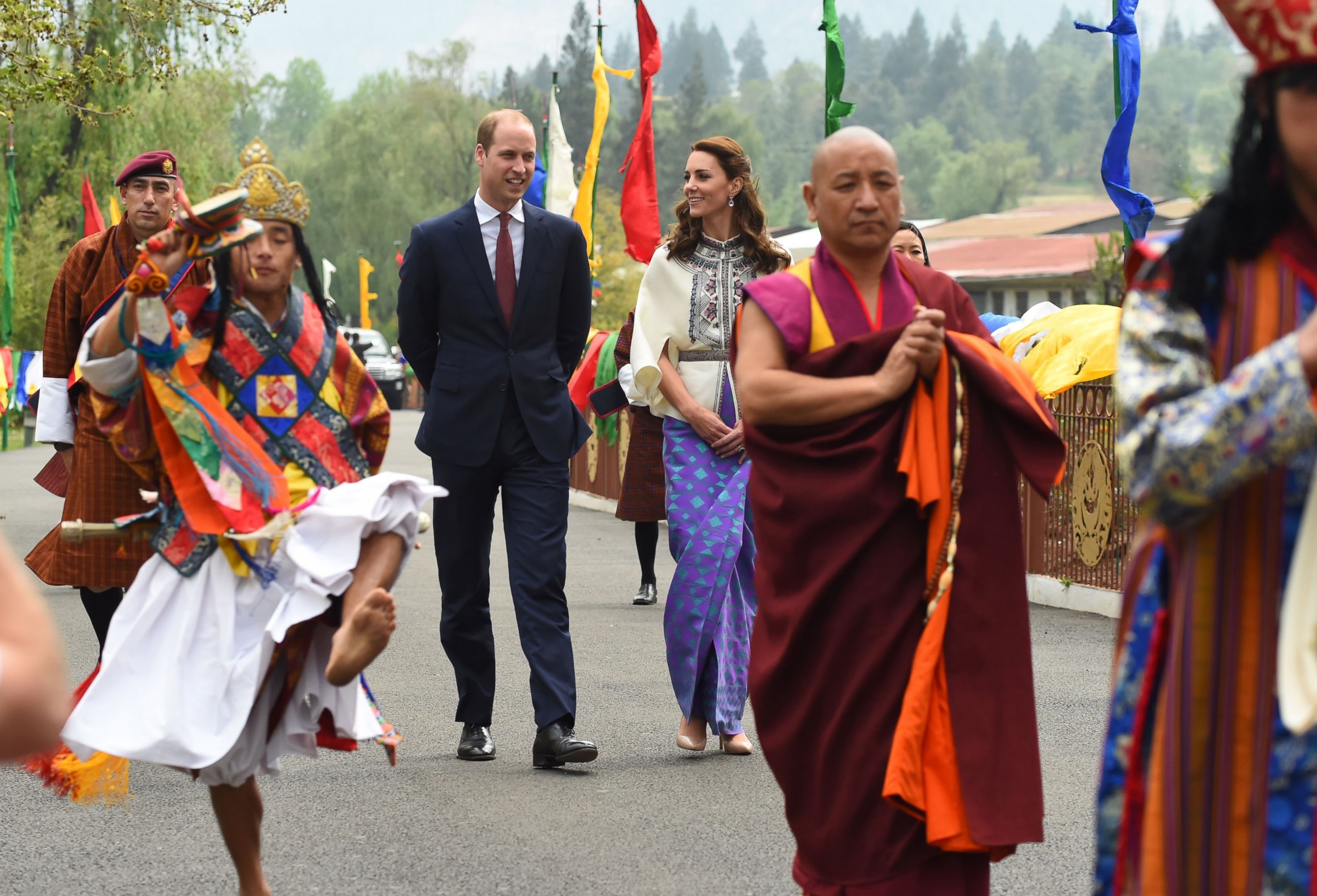 PHOTO:Prince William, Duke of Cambridge and his wife Catherine, Duchess of Cambridge follow a ceremonial procession after arriving at the Tashicho Dzong to meet the King and Queen of Bhutan in Thimphu, April 14, 2016.   