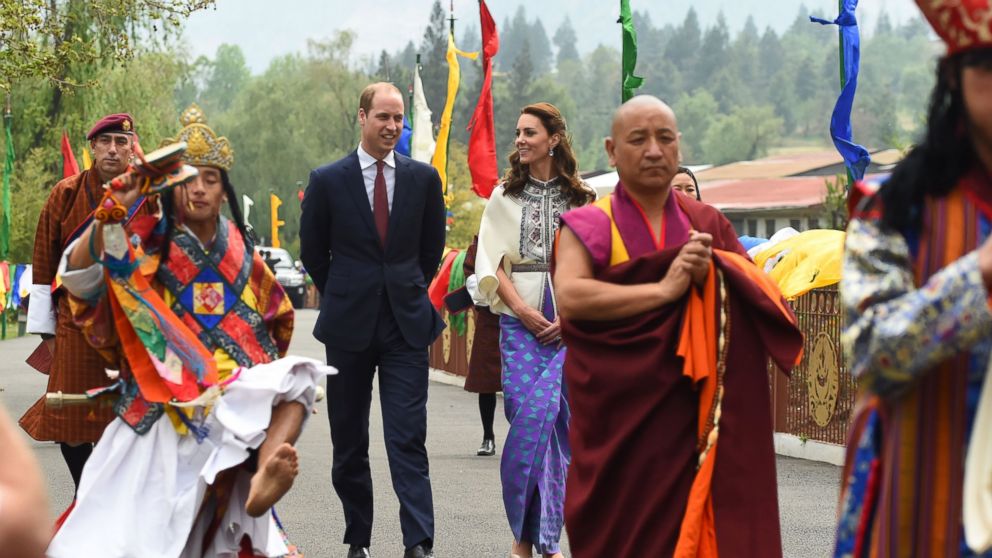 PHOTO:Prince William, Duke of Cambridge and his wife Catherine, Duchess of Cambridge follow a ceremonial procession after arriving at the Tashicho Dzong to meet the King and Queen of Bhutan in Thimphu, April 14, 2016.   
