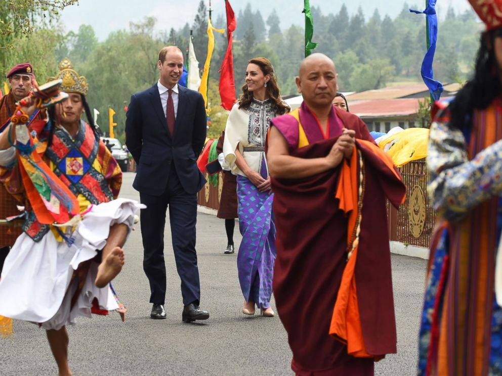 PHOTO:Prince William, Duke of Cambridge and his wife Catherine, Duchess of Cambridge follow a ceremonial procession after arriving at the Tashicho Dzong to meet the King and Queen of Bhutan in Thimphu, April 14, 2016.