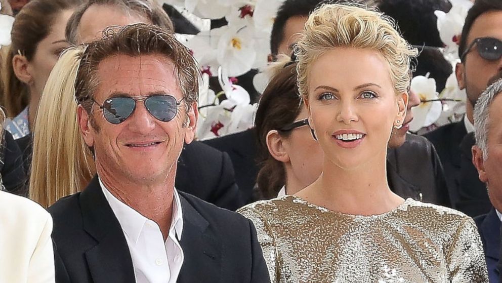 Sean Penn and Charlize Theron attend the Christian Dior show as part of Paris Fashion Week - Haute Couture Fall/Winter 2014-2015 at Muse Rodin, July 7, 2014, in Paris.