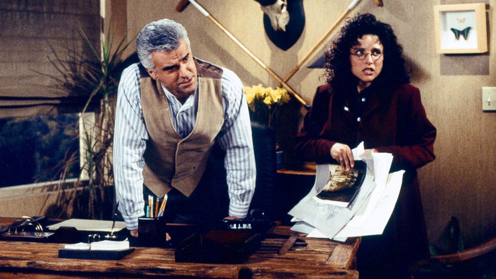 John O'Hurley as J. Peterman and Julia Louis-Dreyfus as Elaine Benes in a scene from 'Seinfeld.'