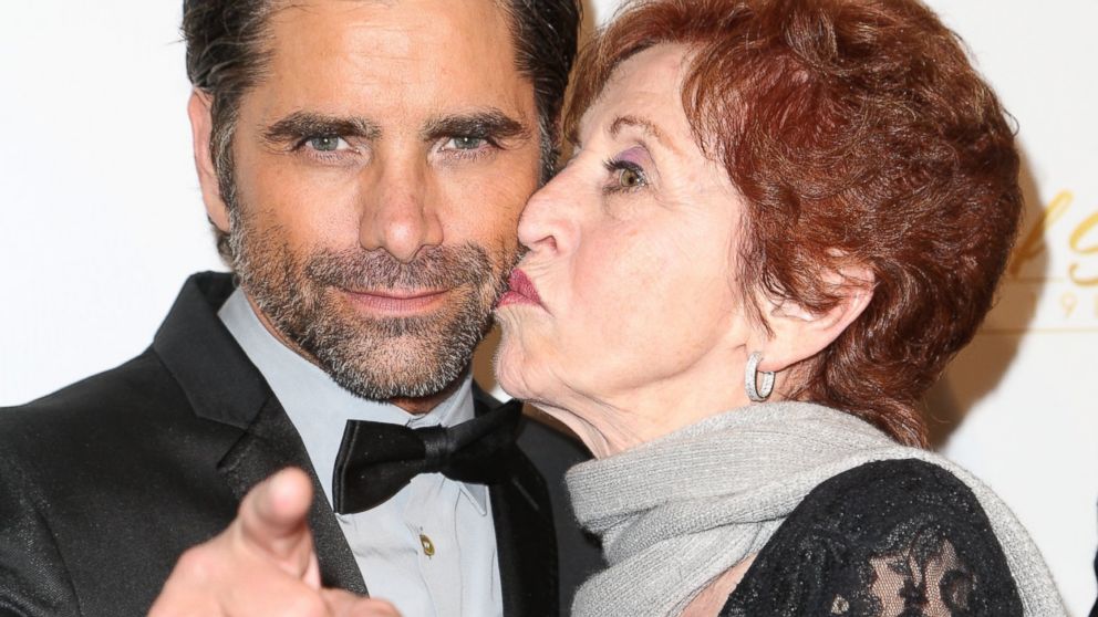 Actor John Stamos and mother Loretta Phillips arrive at the 21st ELLA Awards at The Beverly Hilton Hotel, Feb. 20, 2014, in Beverly Hills, Calif.  