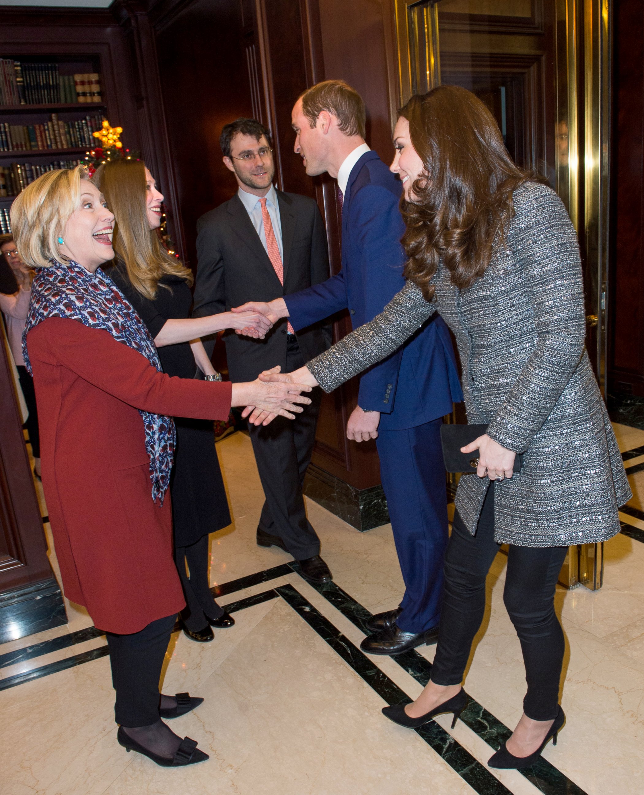 PHOTO: Catherine, Duchess of Cambridge, right, meets former United States Secretary of State, Hillary Clinton as Prince William, Duke of Cambridge meets Chelsea Clinton, Dec. 8, 2014.