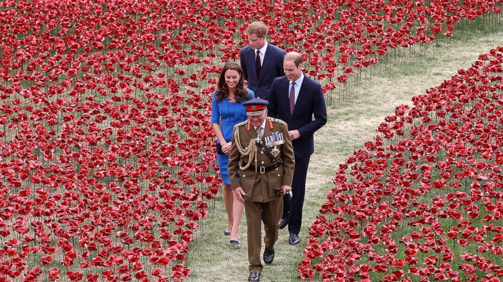 General The Lord Dannatt, Constable of the Tower of London gives Prince Harry, Catherine, Duchess of Cambridge and Prince William, Duke of Cambridge a tour as they attend the ceramic poppy field of remembrance at Tower of London in London, England, August 5, 2014.