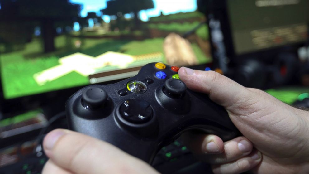 A visitor holds an Xbox One controller during the EGX gaming conference at Earls Court in London, Sept. 25, 2014. 