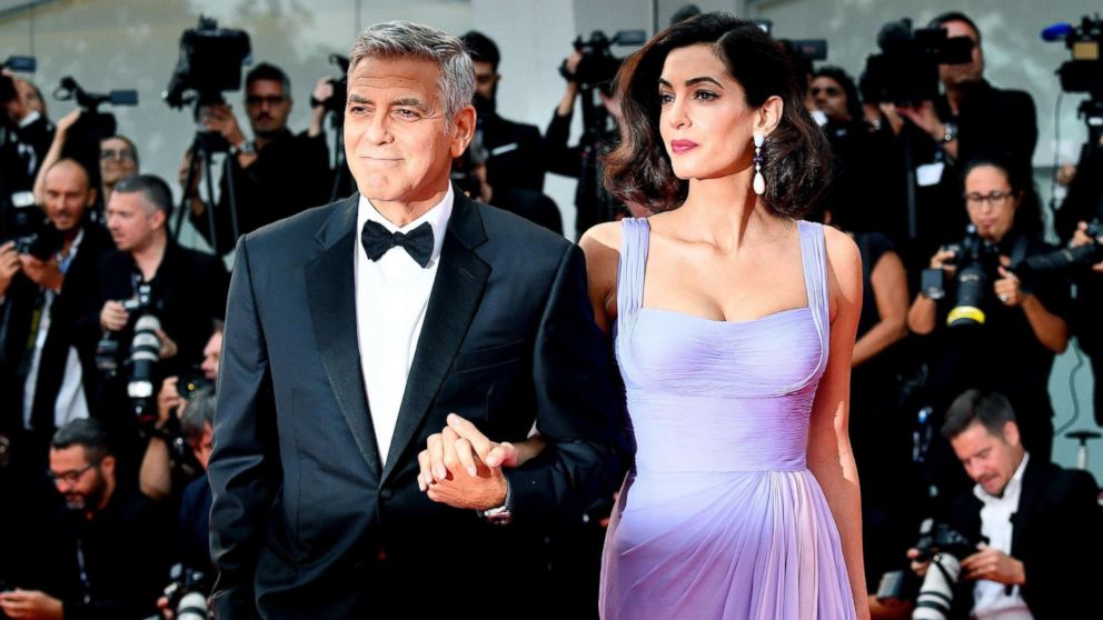 George Clooney with his wife British human rights barrister Amal Alamuddin Clooney arrive for the premiere of 'Suburbicon' during the 74th Venice Film Festival in Venice, Italy, Sept. 2, 2017.