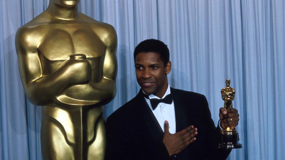 Denzel Washington stands backstage during the 62nd Academy Awards ceremony, March 26, 1990, in Los Angeles. Washington received an Oscar for Best Actor in a Supporting Role for his performance as Trip in 'Glory.'