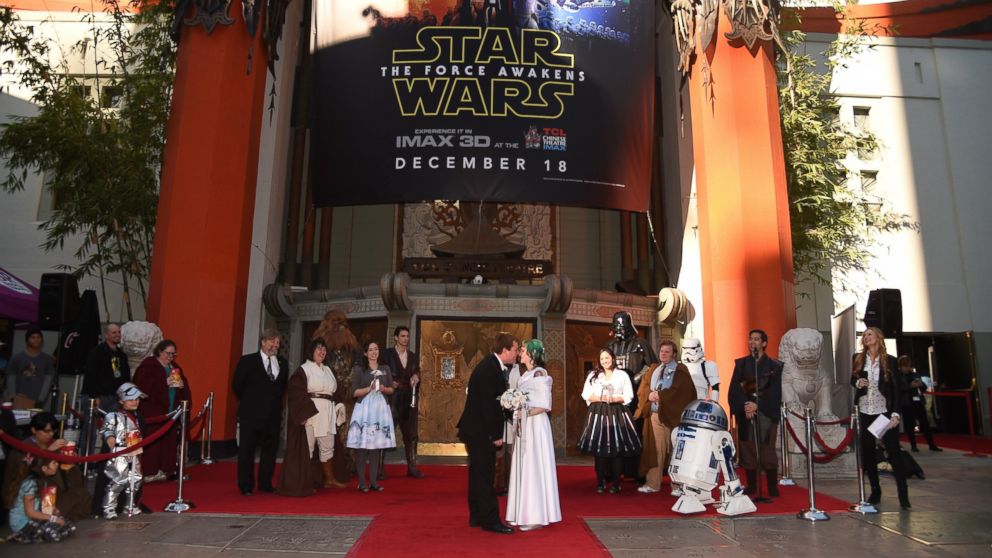 "Star Wars" fans Caroline Ritter, 34, and Andrew Porters, 29, celebrate their marriage in a "Star Wars"-themed wedding, in front of the Chinese Theatre, Dec. 17, 2015 in Hollywood, Calif. 
