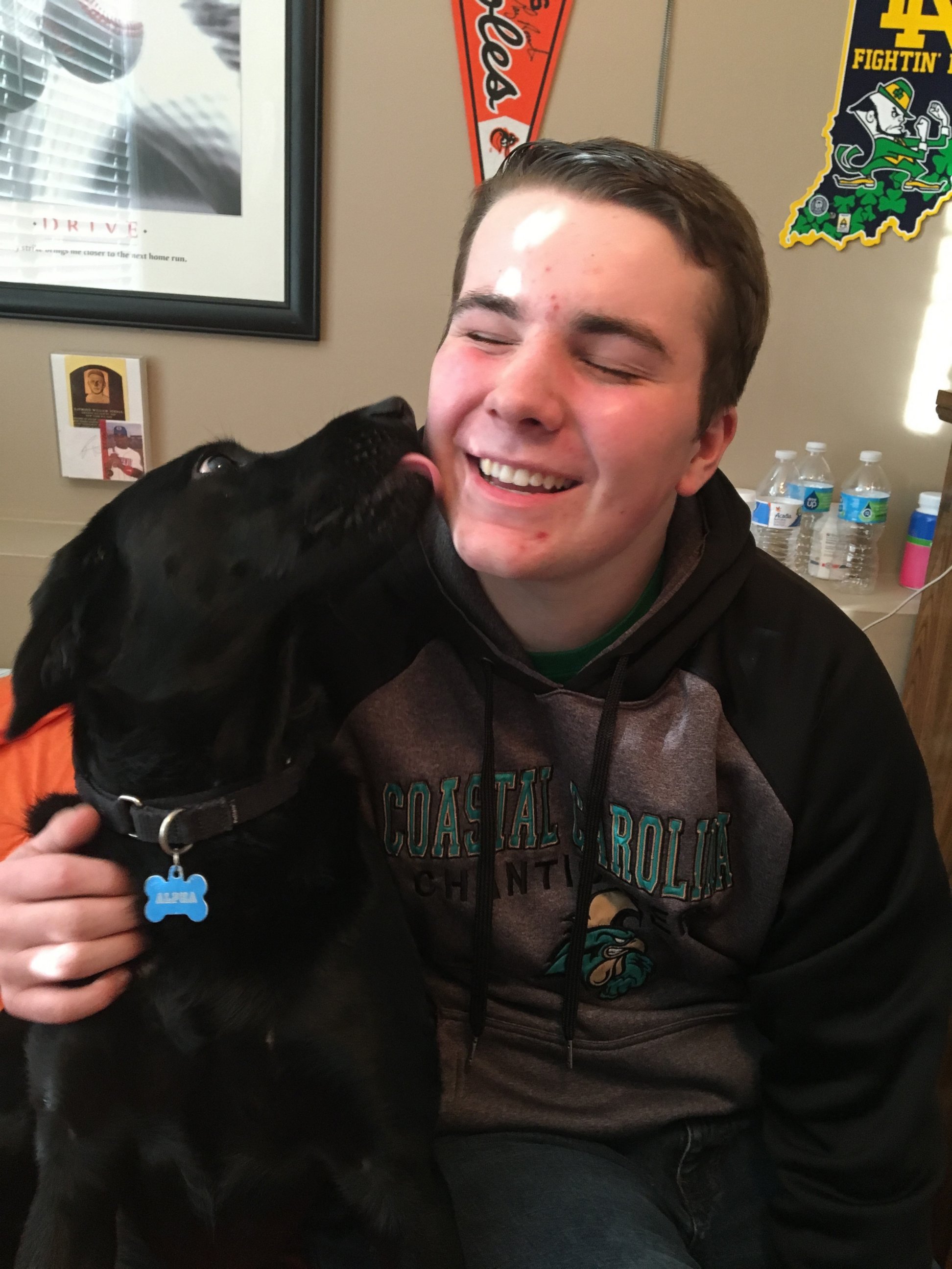 PHOTO: AJ" Schalk, a junior at Stafford High School in Fredericksburg, Va., attends school with his service dog, Alpha.
