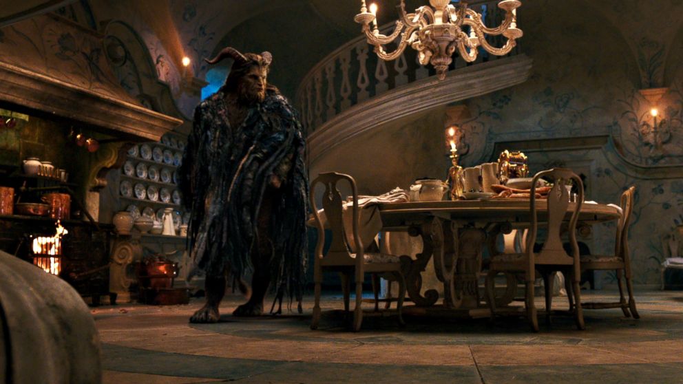 PHOTO: The Beast (Dan Stevens) with Lumiere the candelabra and Cogsworth the mantel clock in the castle kitchen in Disney's "Beauty and the Beast," an adaptation of the studio's animated classic. 