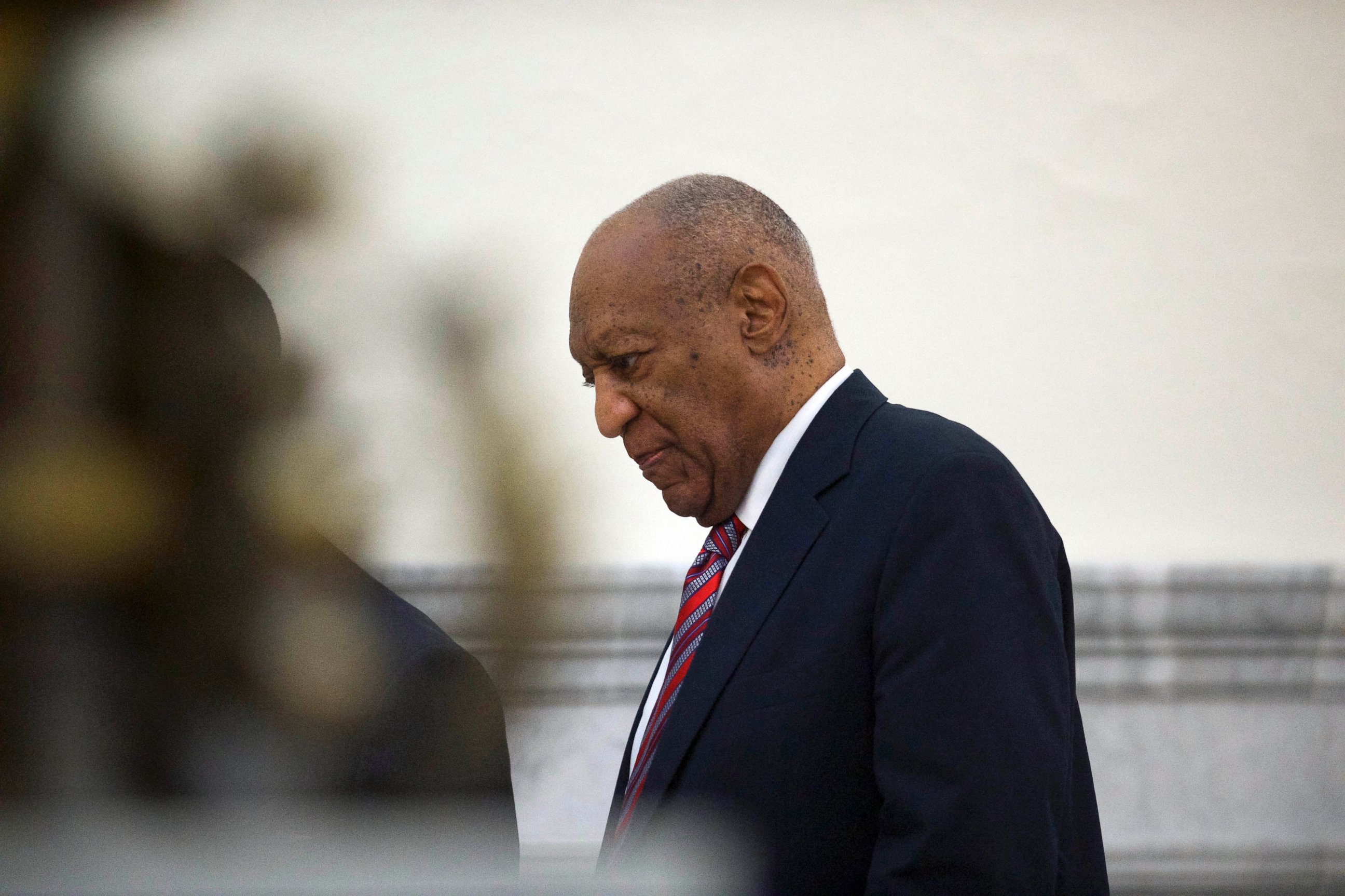 PHOTO: Bill Cosby walks through the Montgomery County Courthouse in Norristown, Pa., June 7, 2017, on the third day of his sexual assault trial.