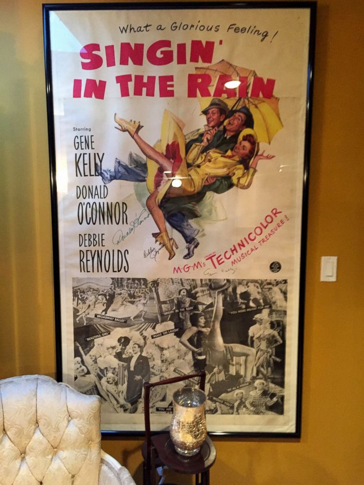 PHOTO: A "Singin' in the Rain" poster that belonged to Debbie Reynolds and was signed by Gene Kelly, Donald O'Connor, and herself. 